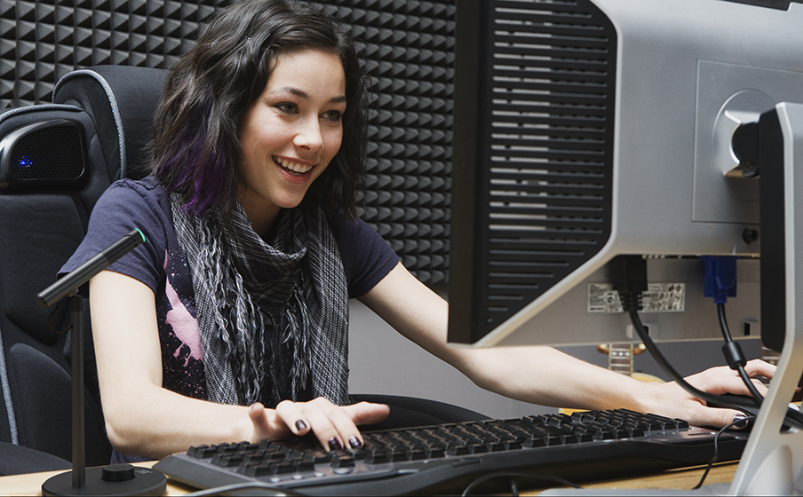 A Stylish Jbl Quantum Stream Talk Microphone On A Sleek Gaming Desk With Modern Accessories.
